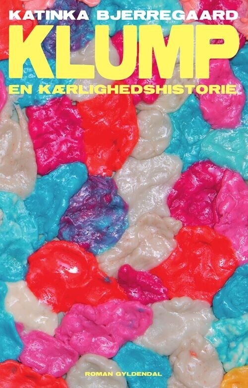 a bunch of chewed gum stuck together to create a colourful background